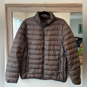 TUMI puffer jacket. Size L. Packable jacket that turns into pillow - see photo.